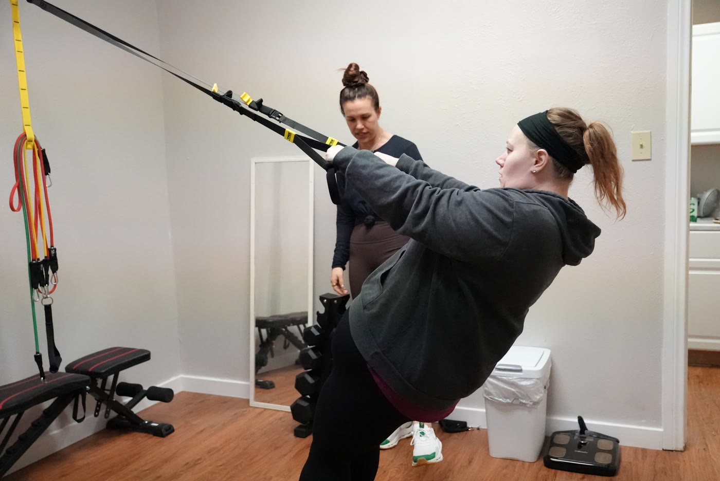 Trainer and client during a weight management session